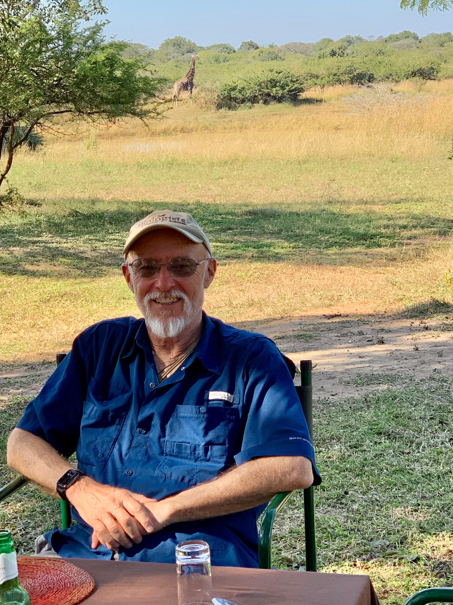 Dale with giraffe in background
